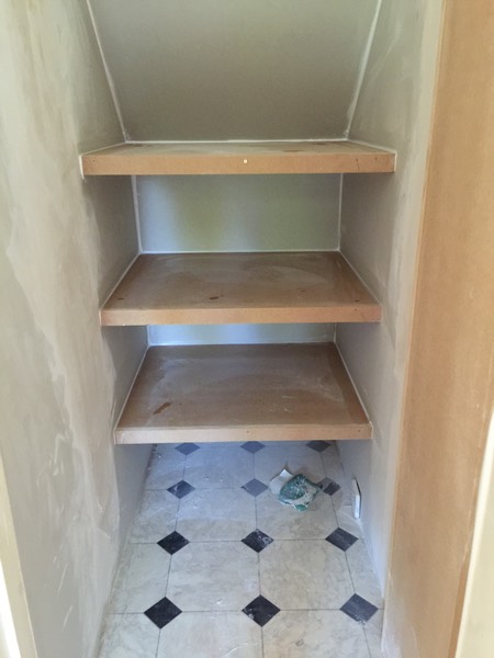 Under Stairs cupboard plastering and shelves